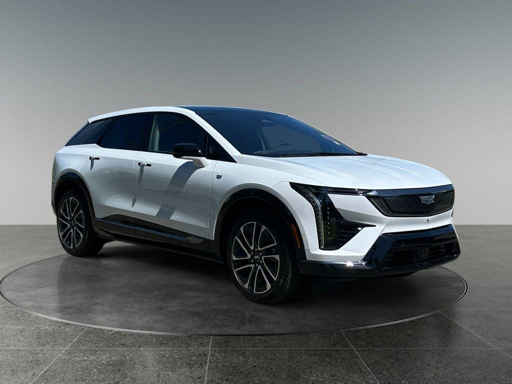 2026 Cadillac OPTIQ Sport in Vibrant White Tricoat — front three-quarter view