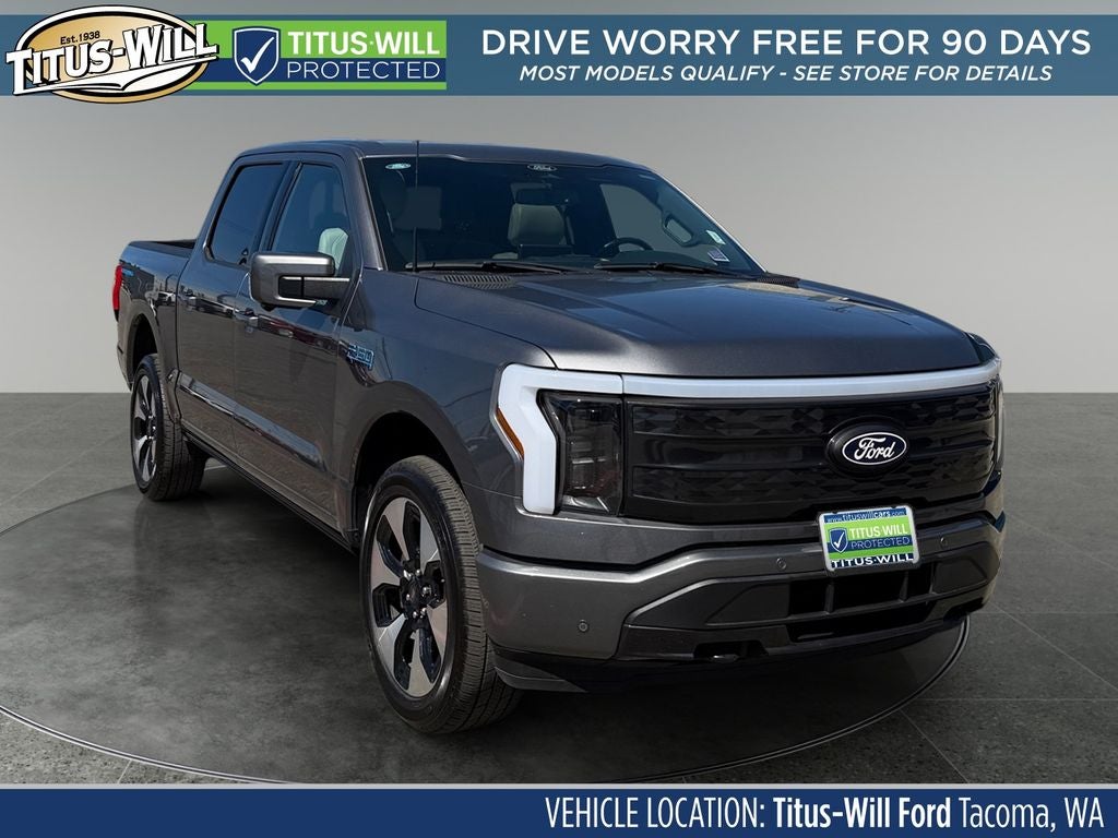2024 Ford F-150 Lightning Platinum in Gray Metallic — front three-quarter view