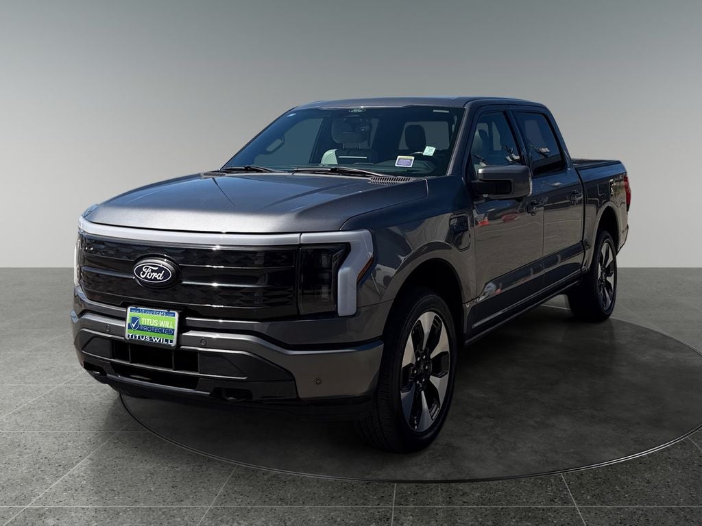 2024 Ford F-150 Lightning — rear three-quarter view