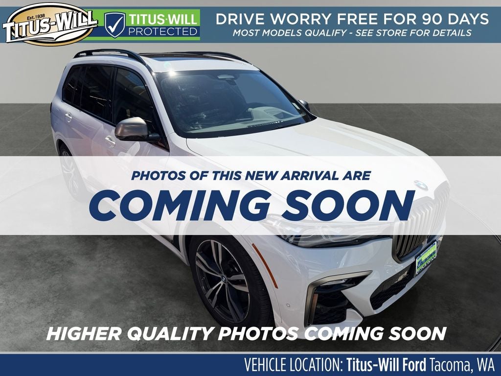 2022 BMW X7 M50i KIP'S WHIP in Alpine White — front three-quarter view